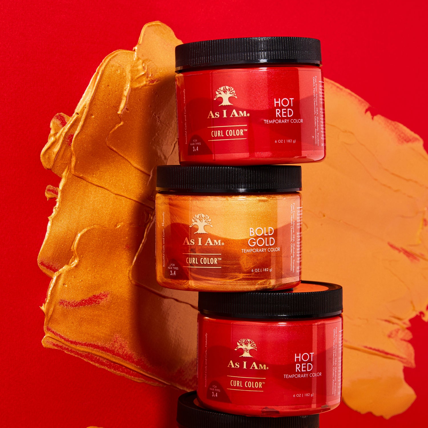 As I Am Curl Color en Hot Red y Bold Gold: dos tarros apilados para mostrar vibrantes geles de coloración temporal que realzan los rizos con un color intenso, definición y brillo.