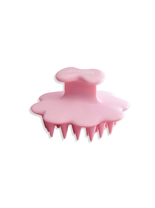 Cepillo de cuero cabelludo rosa sobre fondo blanco